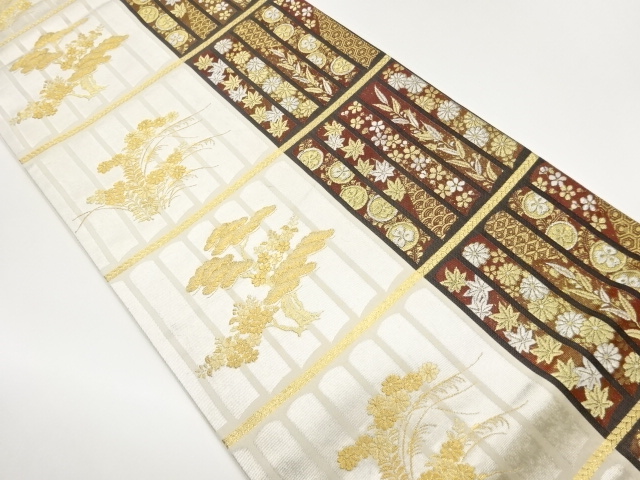 変わり縞に草花・古典柄模様織出し袋帯